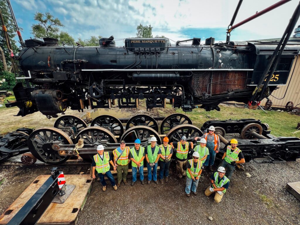FMW Solutions managing a steam locomotive restoration, with the locomotive lifted from its frame for driving wheel removal, mechanical repairs, boiler work, and return-to-service overhaul.